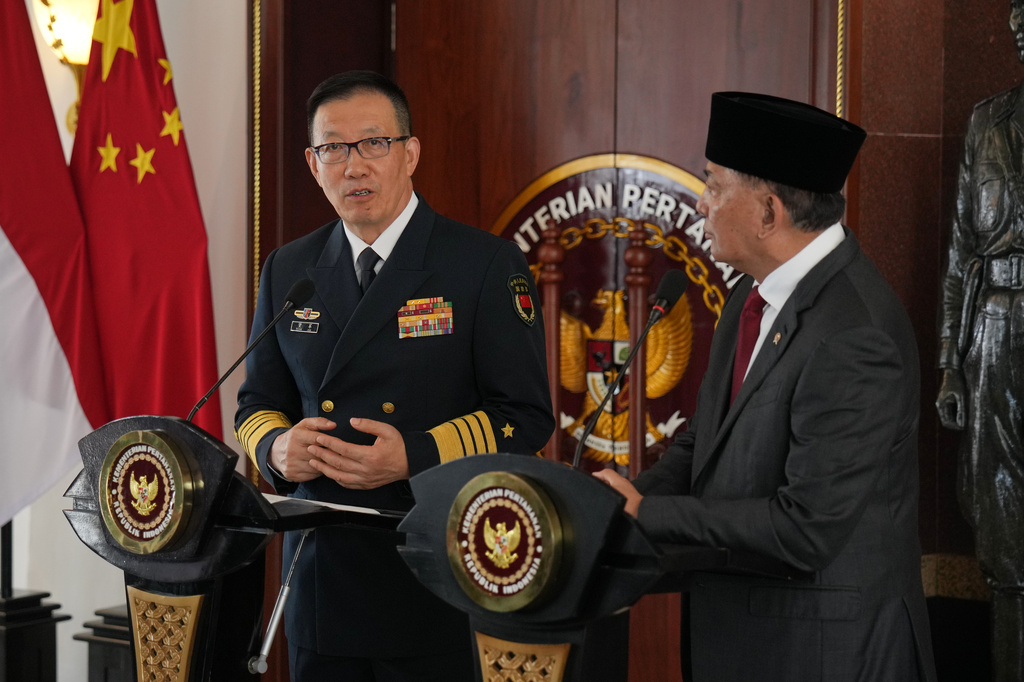 China's Defense Minister Dong Jun, left, delivers a statement as his Indonesian counterpart Sjafrie Sjamsoeddin looks on during their meeting in Jakarta, Indonesia, Friday, Aug. 21, 2026. (AP Photo/Dita Alangkara)