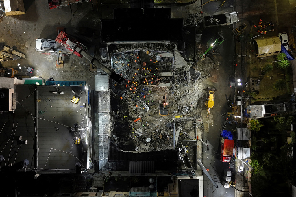 FILE - Rescue workers search for bodies at the Jet Set nightclub after its roof collapsed during a merengue concert in Santo Domingo, Dominican Republic, April 10, 2025. (AP Photo/Matias Delacroix, File)