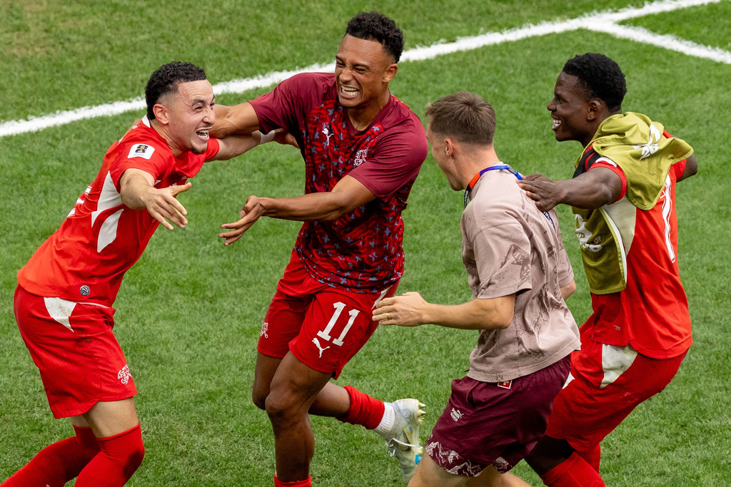 Switzerland's Ruben Vargas, left, celebrates with teammates after making the winning kick in a penalty shootout in the World Cup round of 16 soccer match between Switzerland and Colombia in Vancouver, British Columbia, Tuesday, July 7, 2026. (Timothy Matwey/The Canadian Press via AP)