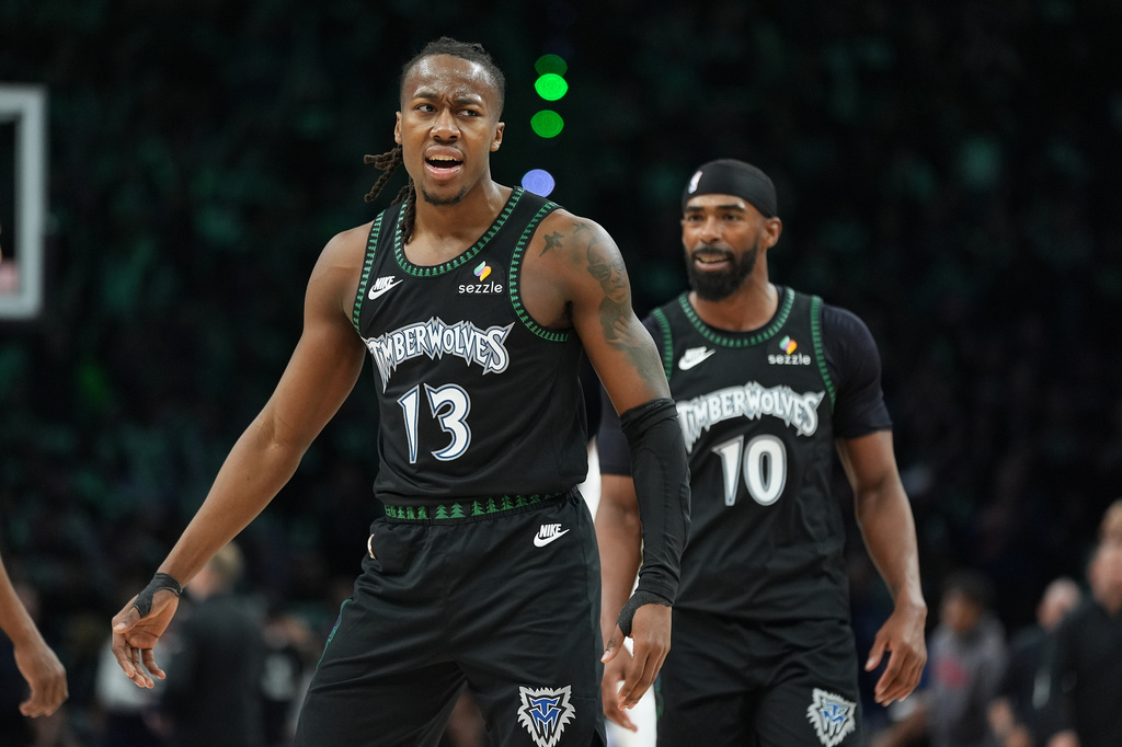 Minnesota Timberwolves guard Ayo Dosunmu (13) celebrates after making a 3-point basket during the second half of Game 4 of a first-round NBA basketball playoff series against the Denver Nuggets, Saturday, April 25, 2026, in Minneapolis. (AP Photo/Abbie Parr)