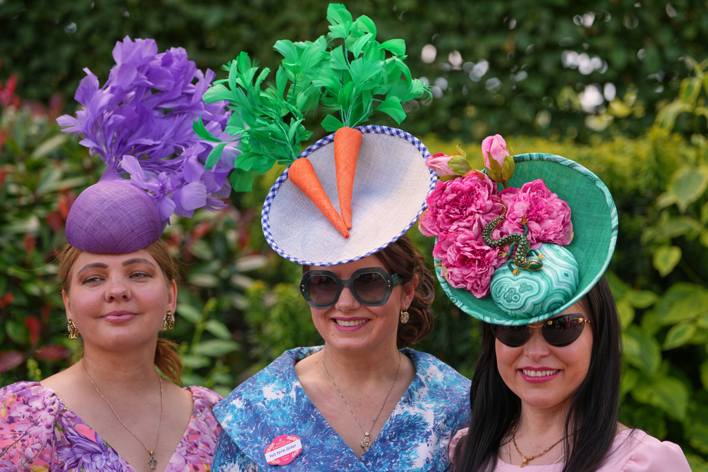 Racegoers pose for pictures on the first day of the Royal Ascot horse race meeting in Ascot, England, Tuesday, June 16, 2026.(AP Photo/Kin Cheung)