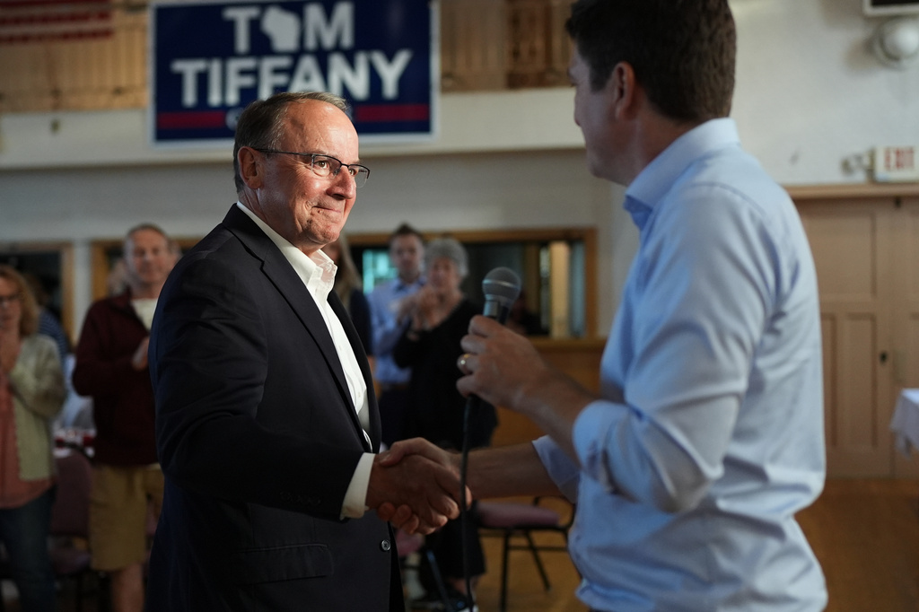 Republican gubernatorial candidate Tom Tiffany, left, shakes hands with Bryan Steil, the U.S. Representative for Wisconsin's 1st congressional district during a campaign event, Wednesday, July 29, 2026, in Kenosha, WI. (AP Photo/Nam Y. Huh)