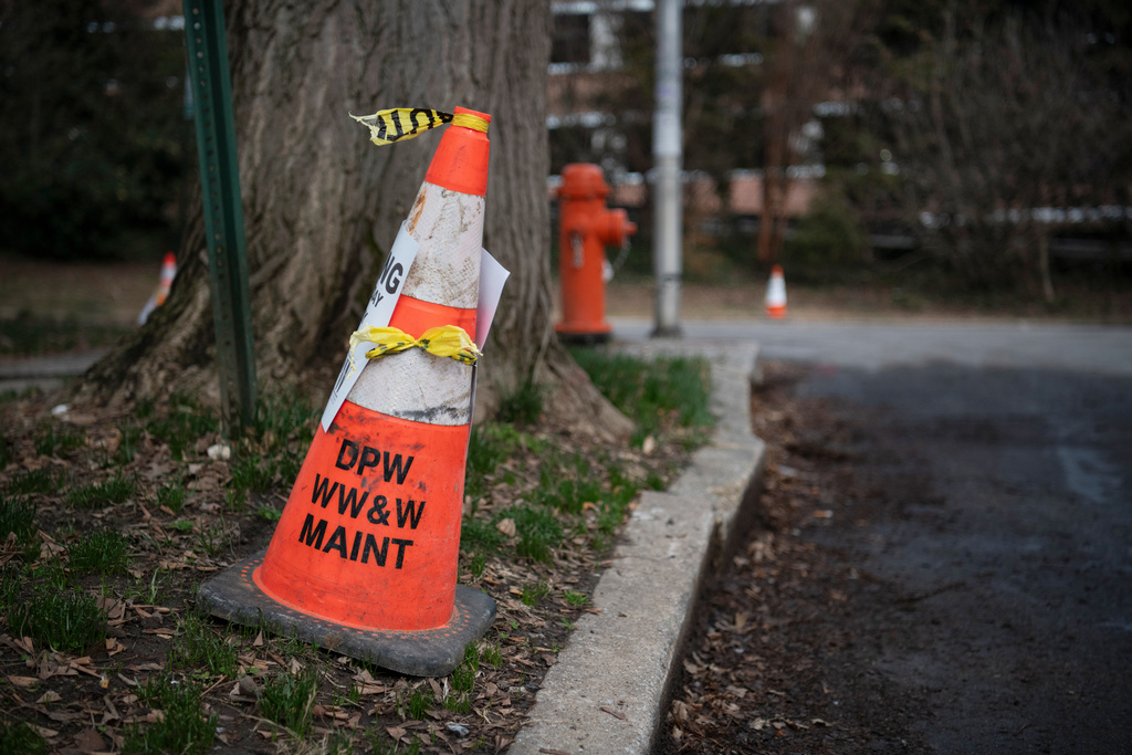 A cone with the letters of the Baltimore City Department of Public Works, which managers the city's wastewater services is visible on March 5, 2026. (AP Photo/Michael Phillis)