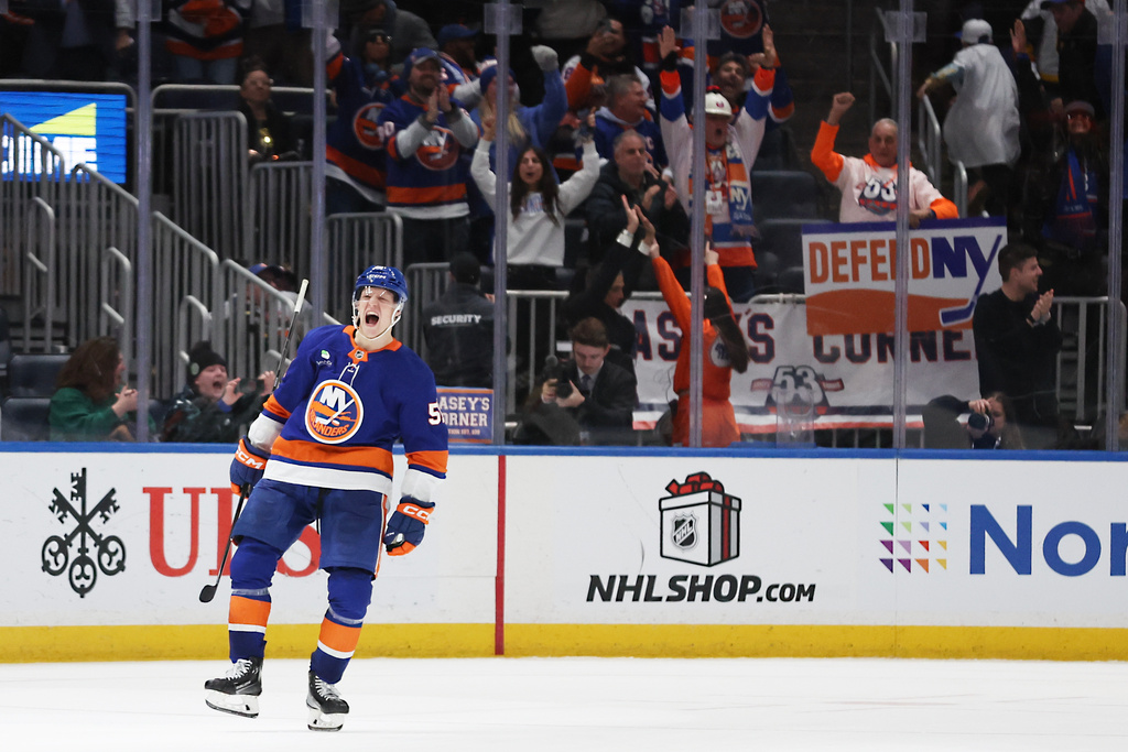 New York Islanders' Emil Heineman (51) celebrates scoring the game-winning goal in a shootout of an NHL hockey game against the Vegas Golden Knights, Tuesday, Dec. 9, 2025, in Elmont, N.Y. (AP Photo/Heather Khalifa)