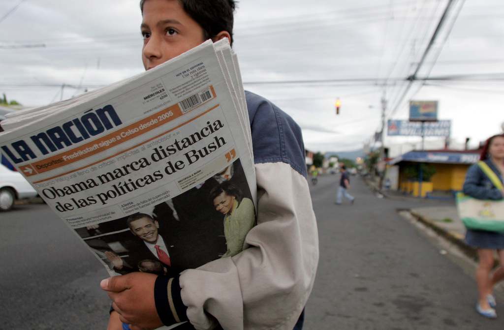 FILE - A vender sells La Nation newspapers in San Jose, Jan. 21, 2009. (AP Photo/Kent Gilbert, File)