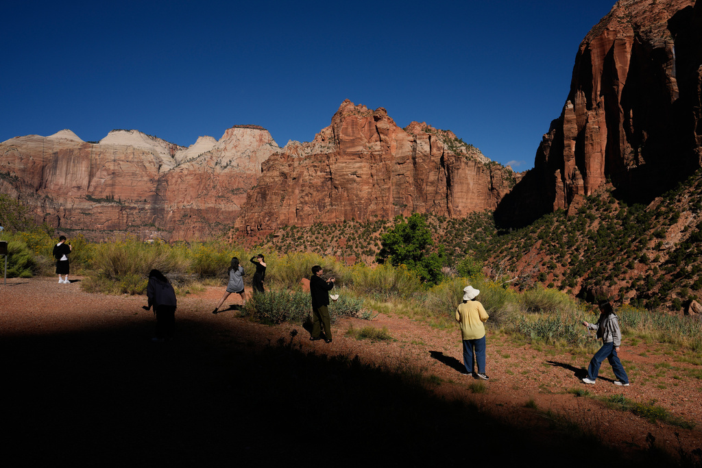 People visit Zion National Park, Wednesday, Oct. 1, 2025, near Springdale, Utah. (AP Photo/John Locher)