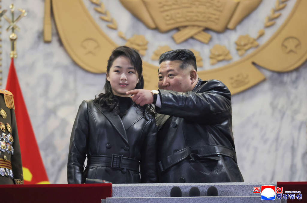 In this photo provided by the North Korean government, its leader Kim Jong Un attends a parade with his daughter in Pyongyang, North Korea Wednesday, Feb. 25, 2026 as the North wrapped up the Workers’ Party congress. Independent journalists were not given access to cover the event depicted in this image distributed by the North Korean government. The content of this image is as provided and cannot be independently verified. Korean language watermark on image as provided by source reads: "KCNA" which is the abbreviation for Korean Central News Agency. (Korean Central News Agency/Korea News Service via AP)