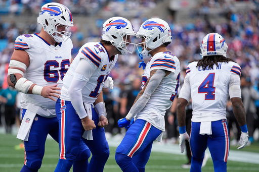 Buffalo Bills quarterback Josh Allen (17) celebrates with Buffalo Bills wide receiver Khalil Shakir after Shakir scored against the Carolina Panthers during the second half an NFL football game, Sunday, Oct. 26, 2025, in Charlotte, N.C. (AP Photo/Jacob Kupferman) Buffalo Bills quarterback Josh Allen (17) celebrates with Buffalo Bills wide receiver Khalil Shakir after Shakir scored against the Carolina Panthers during the second half an NFL football game, Sunday, Oct. 26, 2025, in Charlotte, N.C. (AP Photo/Jacob Kupferman)