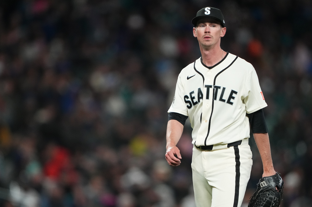 Seattle Mariners starting pitcher Emerson Hancock walks back to the dugout after facing the Cleveland Guardians during the fifth inning of a baseball game, Sunday, March 29, 2026, in Seattle. (AP Photo/Lindsey Wasson)
