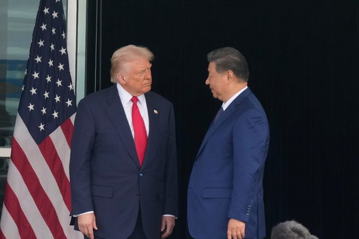 President Donald Trump, left, and Chinese President Xi Jinping, look at each other after their summit meeting at Gimhae International Airport Jinping in Busan, South Korea, Thursday, Oct. 30, 2025. (AP Photo/Mark Schiefelbein) President Donald Trump, left, and Chinese President Xi Jinping, look at each other after their summit meeting at Gimhae International Airport Jinping in Busan, South Korea, Thursday, Oct. 30, 2025. (AP Photo/Mark Schiefelbein)