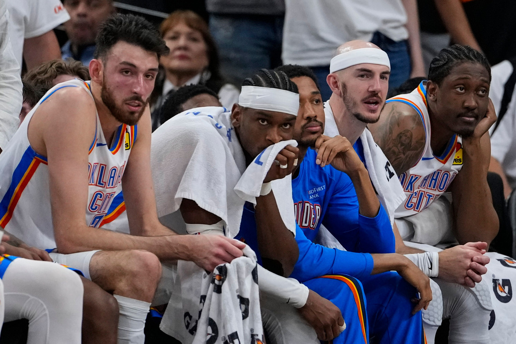 The Oklahoma City Thunder bench watches play against the San Antonio Spurs in the second half of Game 6 in the Western Conference finals NBA basketball playoffs series, Thursday, May 28, 2026, in San Antonio. (AP Photo/David J. Phillip)