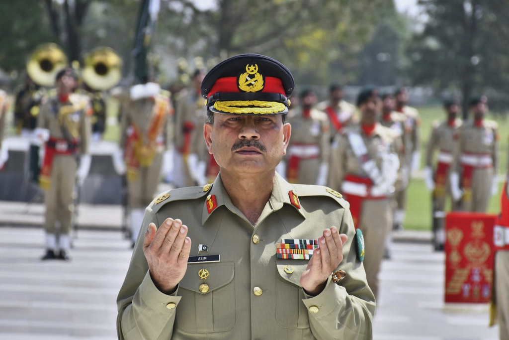 FILE -In this photo released by the Inter Services Public Relations, newly elevated Field Marshal General Asim Munir prays after laying wreath on the Martyrs monument during a special guard of honor ceremony at General Headquarters, in Rawalpindi, Pakistan,, May 21, 2025. (Inter Services Public Relations via AP, File)