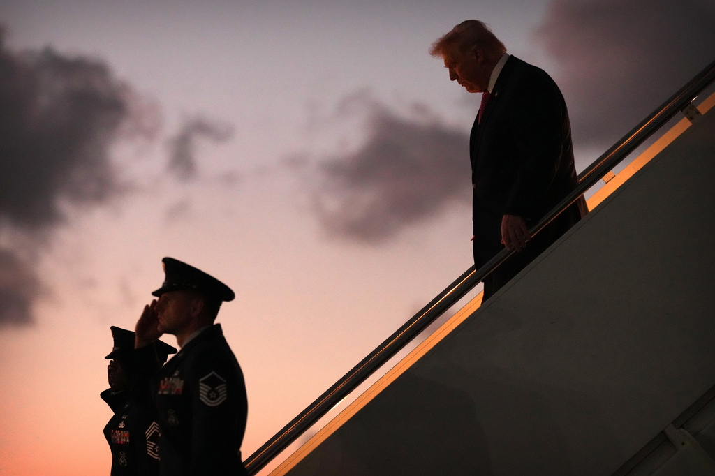 President Donald Trump steps off Air Force One, Friday, March 27, 2026, at Palm Beach International Airport in West Palm Beach, Fla. (AP Photo/Mark Schiefelbein)