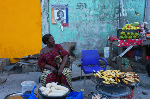 A street vendor sells under a campaign poster of presidential candidate Simone Gbagbo in Abidjan, Ivory Coast, Tuesday, Oct. 22, 2025. (AP Photo/Misper Apawu) A street vendor sells under a campaign poster of presidential candidate Simone Gbagbo in Abidjan, Ivory Coast, Tuesday, Oct. 22, 2025. (AP Photo/Misper Apawu)
