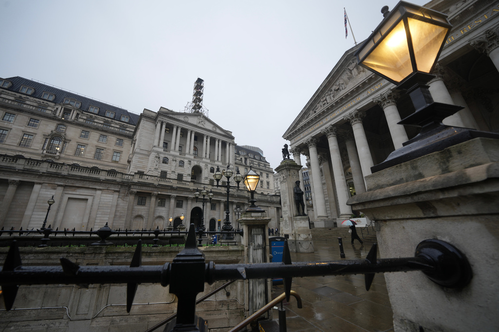 FILE -A man walks in front of the Bank of England, at the financial district in London, Feb. 5, 2026 (AP Photo/Kin Cheung, File)