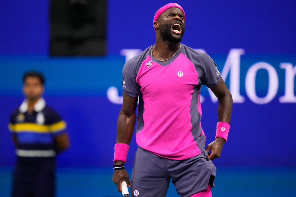 Frances Tiafoe, of the United States, reacts during the men's singles semifinals of the U.S. Open tennis championships against Ben Shelton, of the United States, Friday, Sept. 11, 2026, in New York. (AP Photo/Yuki Iwamura)