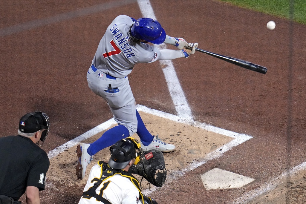 Chicago Cubs' Dansby Swanson (7) doubles off Pittsburgh Pirates pitcher Braxton Ashcraft, driving in a run, during the fourth inning of a baseball game in Pittsburgh, Monday, Sept. 15, 2025. (AP Photo/Gene J. Puskar)