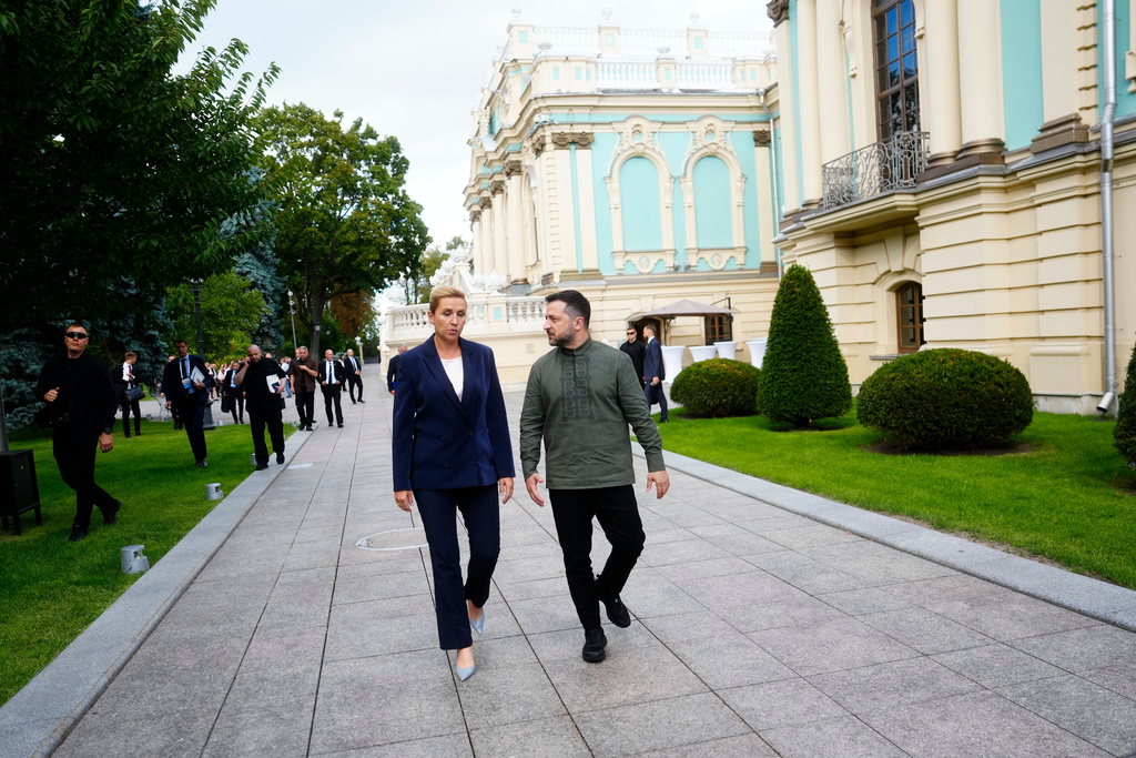 Denmark's Prime Minister Mette Frederiksen walks with Ukrainian President Volodymyr Zelenskyy at the Mariinskyi Palace in Kyiv, Ukraine, on Sunday, Aug. 23, 2026. (Mads Claus Rasmussen/Ritzau Scanpix via AP)