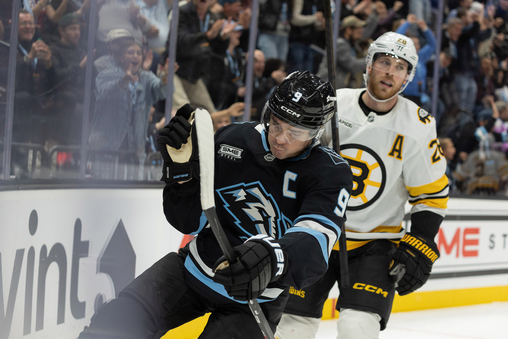 Utah Mammoth center Clayton Keller (9) celebrates the goal against Boston Bruins during the second period of an NHL hockey game Sunday, Oct. 19, 2025, in Salt Lake City. (AP Photo/Melissa Majchrzak)