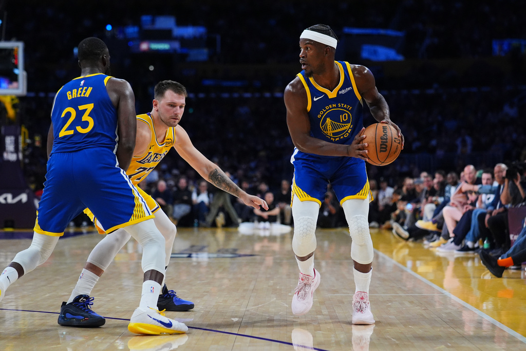 Golden State Warriors forward Jimmy Butler III (10) looks for a passing lane during the first half of an NBA basketball game against the Los Angeles Lakers, Tuesday, Oct. 21, 2025, in Los Angeles. (AP Photo/Ethan Swope)