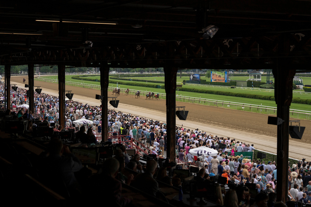 Spectators watch the second race of the day before the 158th running of the Belmont Stakes horse race at Saratoga Race Course, Saturday, June 6, 2026, in Saratoga Springs, N.Y. (AP Photo/Yuki Iwamura)