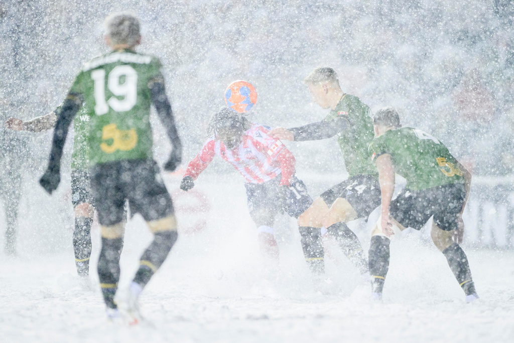 Atletico Ottawa's Kévin David Nogueira Carvalho Dos Santos (19) heads the ball as Cavalry FC's Eryk Kobza (24) fights to gain possession during second half Canadian Premier League finals soccer action in Ottawa, on Sunday, Nov. 9, 2025. (Spencer Colby/The Canadian Press via AP)
