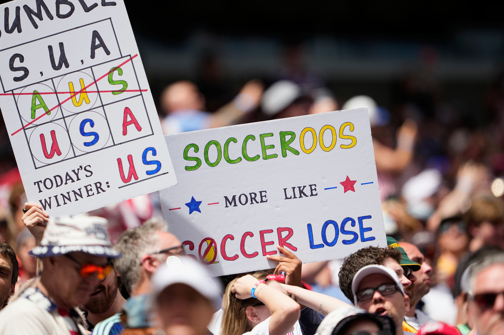 United States fans hold signs on the stand during the World Cup Group D soccer match between the United States and Australia in Seattle, Friday, June 19, 2026. (AP Photo/Lindsey Wasson)