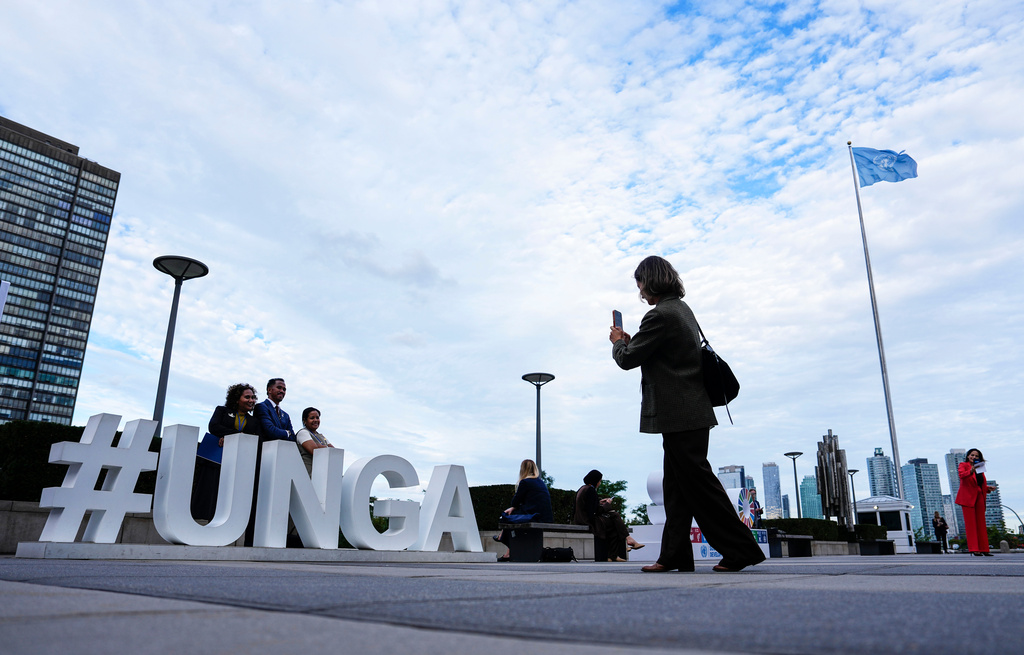 People pose as they arrive for the United Nations General Assembly (UNGA) at the UN headquarters, Monday, Sept. 21, 2026. (Justin Tang/The Canadian Press via AP)