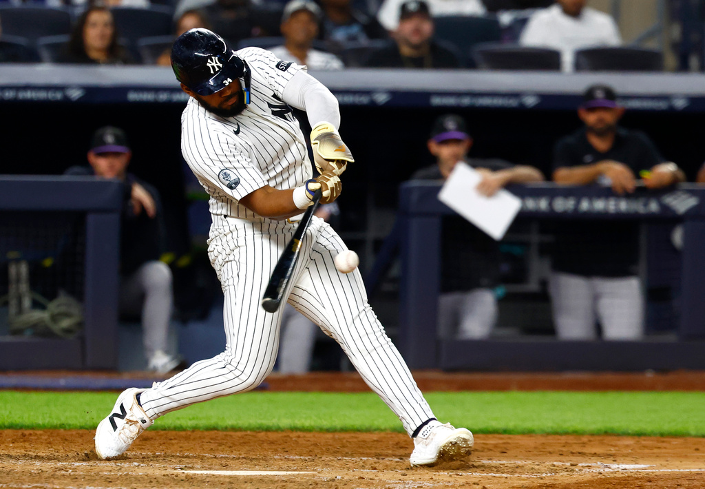 New York Yankees' Heliot Ramos hits a three run home run against the Colorado Rockies during the eighth inning of a baseball game, Tuesday, Sept. 8, 2026, in New York. (AP Photo/Noah K. Murray)