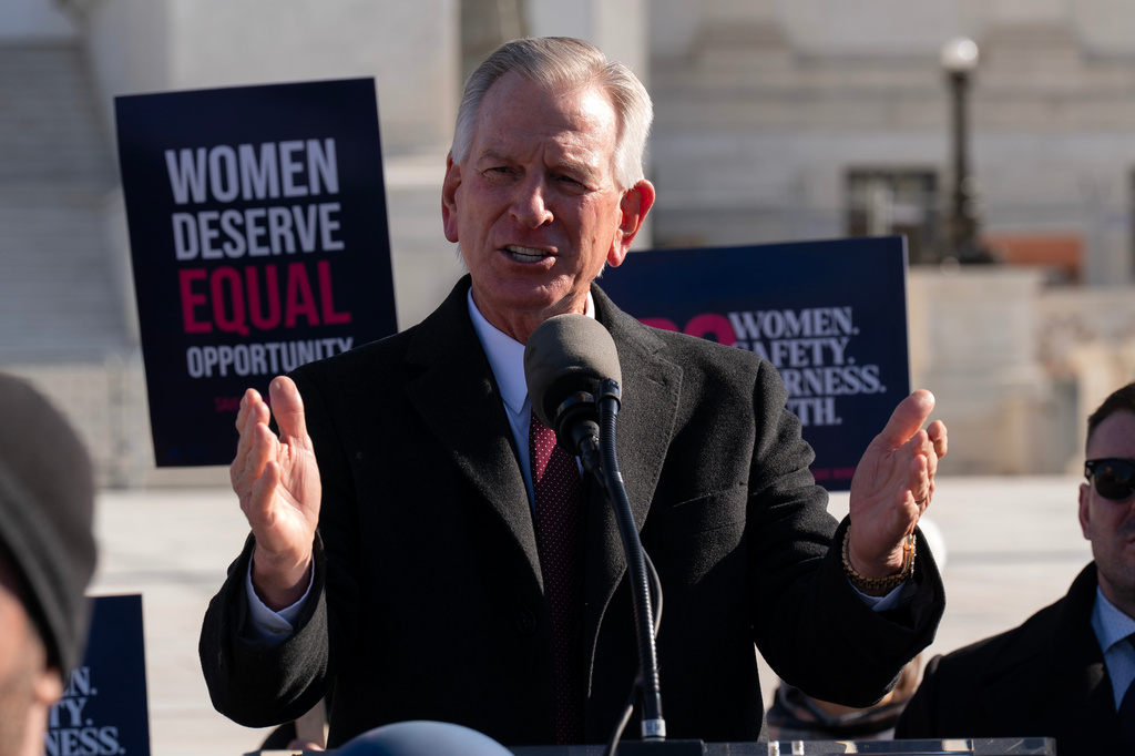 FILE - Sen. Tommy Tuberville, R-Ala., speaks to the crowd as protesters gather outside the Supreme Court as it hears arguments over state laws barring transgender girls and women from playing on school athletic teams, Jan. 13, 2026, in Washington. (AP Photo/Jose Luis Magana, File)