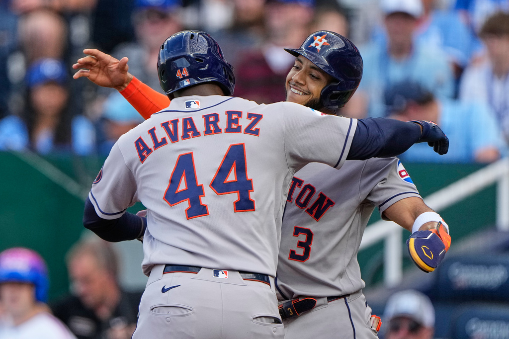 Houston Astros' Yordan Alvarez (44) celebrates with Jeremy Pena (3) after hitting a two-run home run during the first inning of a baseball game against the Kansas City Royals, Friday, June 12, 2026, in Kansas City, Mo. (AP Photo/Charlie Riedel)