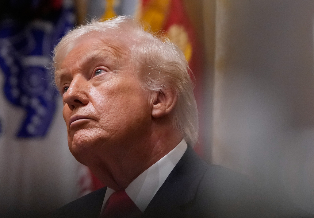 President Donald Trump listens during a Cabinet meeting at the White House, Tuesday, Dec. 2, 2025, in Washington. (AP Photo/Julia Demaree Nikhinson)