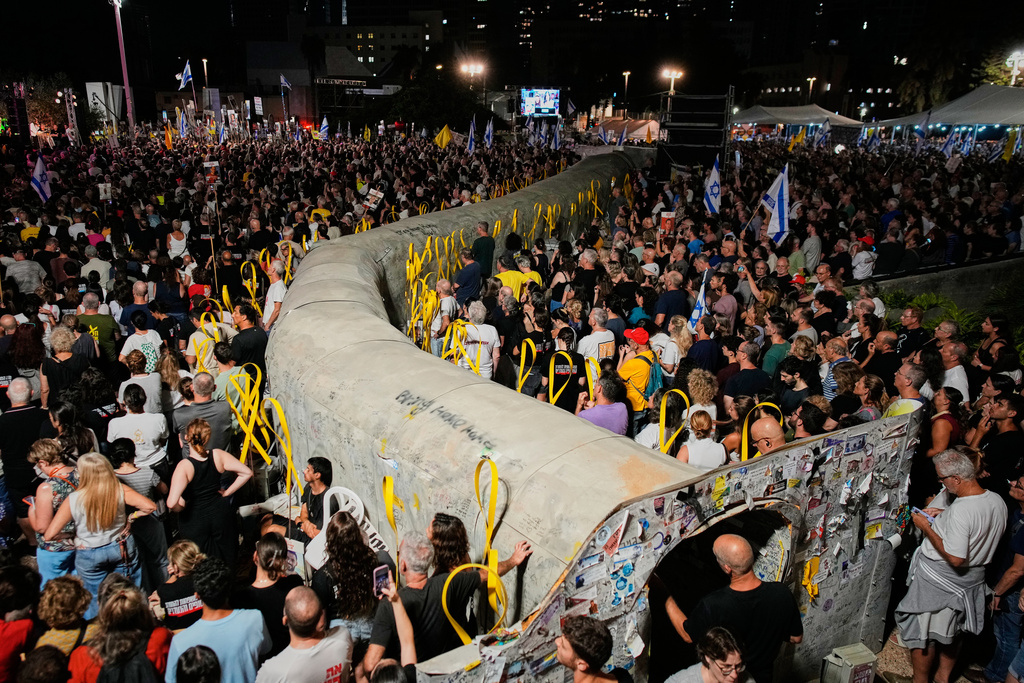 People attend a rally calling for the release of all hostages held by Hamas in the Gaza Strip and urges a ceasefire, in Tel Aviv, Israel, Saturday, Oct. 4, 2025. ahead of the second anniversary of the Israel-Hamas war. (AP Photo/Ohad Zwigenberg)