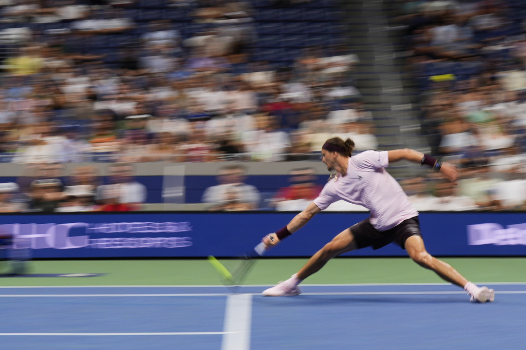 In this image taken with a slow shutter speed, Alexander Zverev, of Germany, hits a return to Quentin Halys, of France, during the second round of the U.S. Open tennis championships, Thursday, Sept. 3, 2026, in New York. (AP Photo/Frank Franklin II)