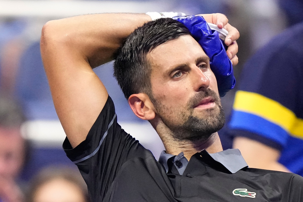 Novak Djokovic, of Serbia, cools off during a match against Mariano Navone, of Argentina, in the first round of the U.S. Open tennis championships Sunday, Aug. 30, 2026, in New York. (AP Photo/Frank Franklin II)