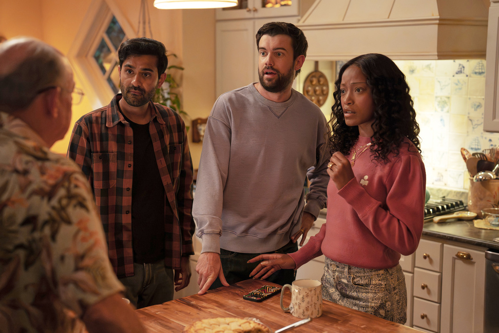 This image released by Peacock shows Kapil Talwakar, background from left, Jack Whitehall and Keke Palmer in a scene from "The Burbs." (Elizabeth Morris/Peacock via AP)