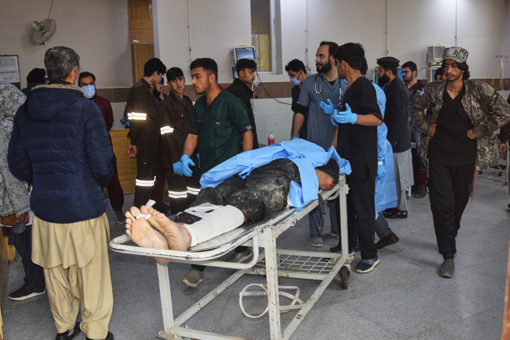 Hospital workers transport a body of a police officer who was killed in a militants attack, at a hospital in Quetta, Pakistan, Saturday, Jan. 31, 2026. (AP Photo/Arshad Butt)