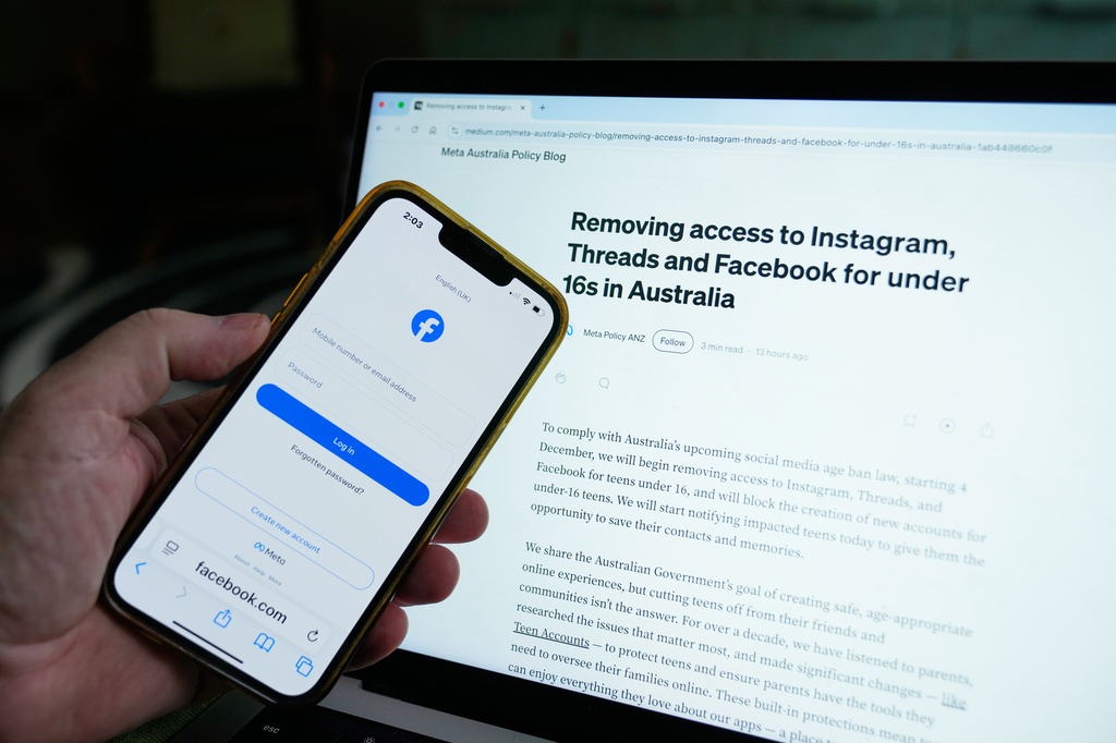 FILE - A logon screen for Facebook and the new Meta policy are photographed in Sydney, Australia, on Nov. 20, 2025. (AP Photo/Rick Rycroft, File)