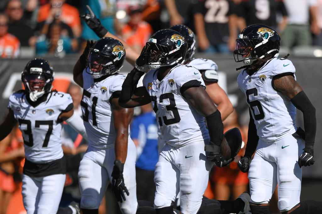Jacksonville Jaguars defensive tackle Matt Dickerson (93) celebrates an interception during an NFL football game against the Cincinnati Bengals in Cincinnati, Sunday, Oct. 4, 2026. (AP Photo/Tanner Pearson)