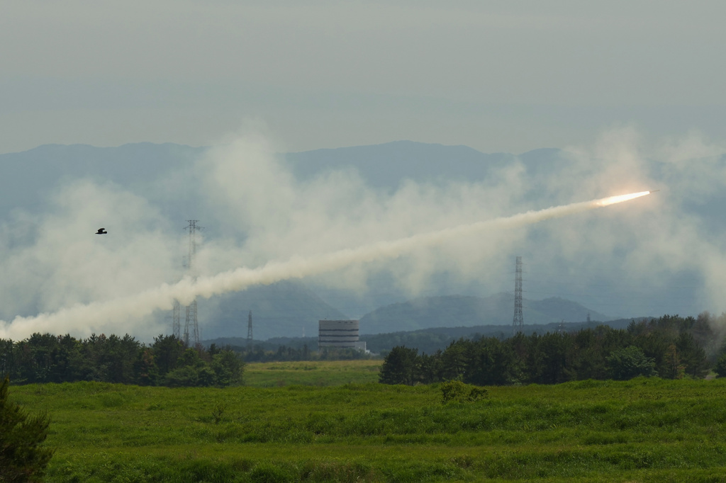 U.S. Marines conduct a live-fire training of the High Mobility Artillery Rocket System, short for HIMARS, at Camp Fuji, in Gotemba, southwest of Tokyo, Wednesday, May 20, 2026. (AP Photo/Hiro Komae)