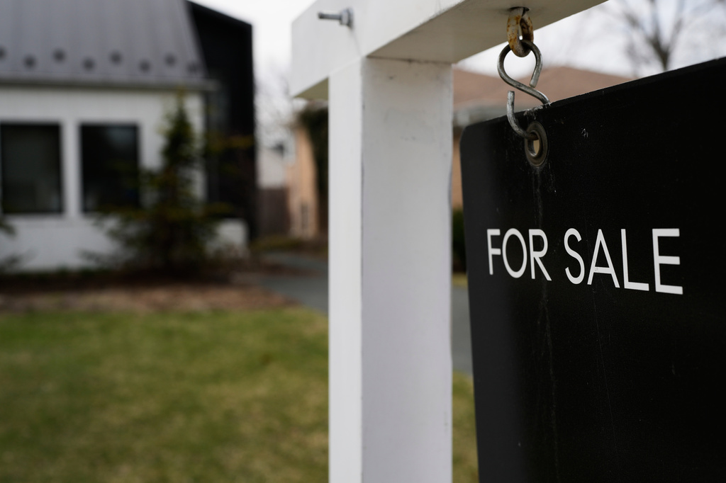 FILE - A for sale sign is displayed in front of a home in Evanston, Ill., on March 25, 2026. (AP Photo/Nam Y. Huh, File)