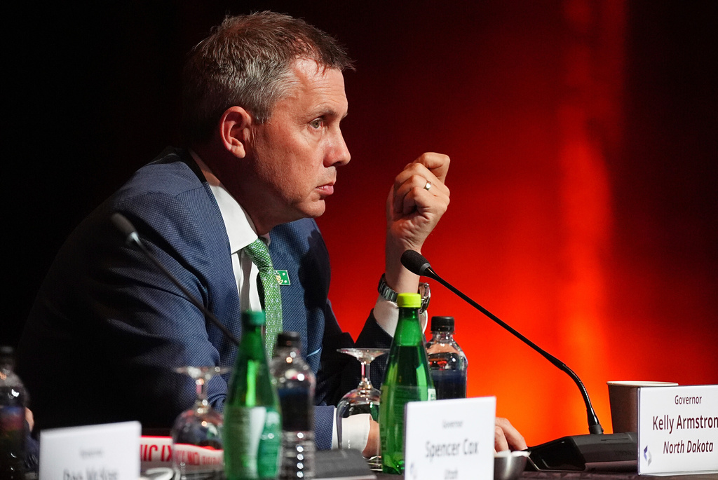 FILE - North Dakota Governor Kelly Armstrong listens to Mark Cuban as he speaks greets during the summer meeting of the National Governors Association at the Broadmoor Hotel in Colorado Springs, Colo., July 25, 2025. (AP Photo/David Zalubowski, File)