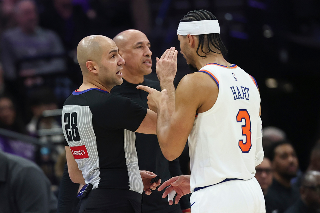 New York Knicks guard Josh Hart (3) reacts to referee Mousa Dagher (28) for foul called on him during the first half of an NBA basketball game Wednesday, Jan. 14, 2026, in Sacramento, Calif. (AP Photo/Sara Nevis)
