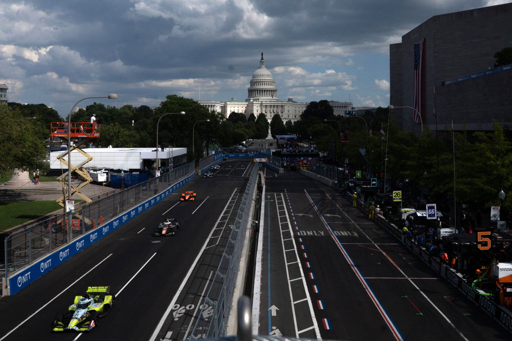 Christian Rasmussen (21), of Denmark, leads a pack of cars during the IndyCar Freedom 250 Grand Prix auto race in Washington, Sunday, Aug. 23, 2026. (AP Photo/Allison Robbert)