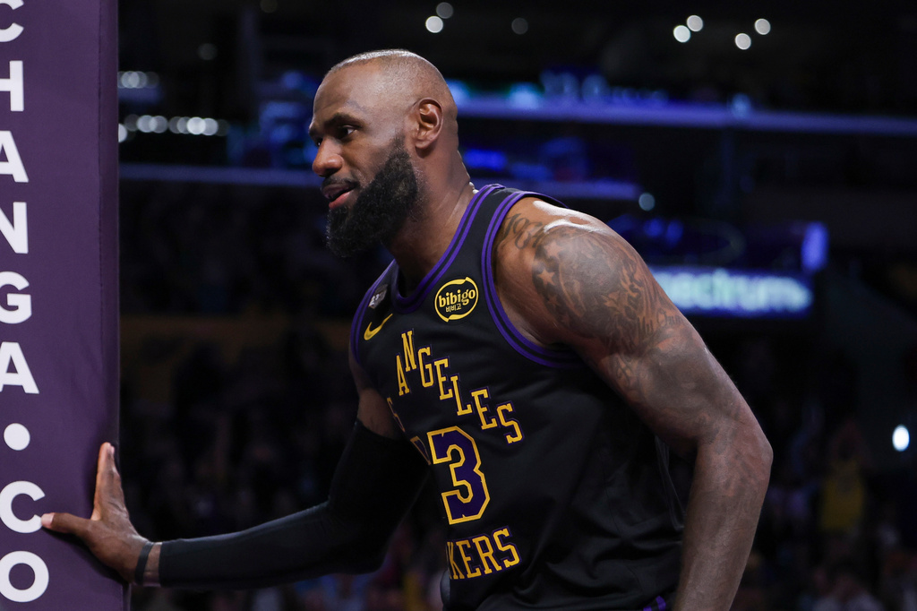 Los Angeles Lakers forward LeBron James reacts after a dunk against the Phoenix Suns during the second half of an NBA basketball game, Friday, April 10, 2026, in Los Angeles. (AP Photo/Jessie Alcheh)