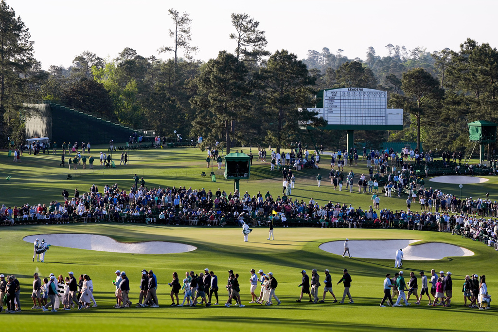 Fans walk on the second hole during the first round of the Masters golf tournament at the Augusta National Golf Club, Thursday, April 9, 2026, in Augusta, Ga. (AP Photo/Ashley Landis)