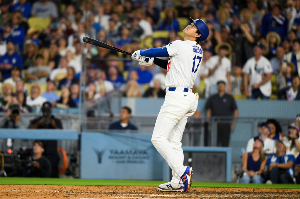 Los Angeles Dodgers' Shohei Ohtani watches after hitting a fly ball during the fifth inning of a baseball game against the San Diego Padres in Los Angeles, Thursday, July 2, 2026. (AP Photo/Kyusung Gong)