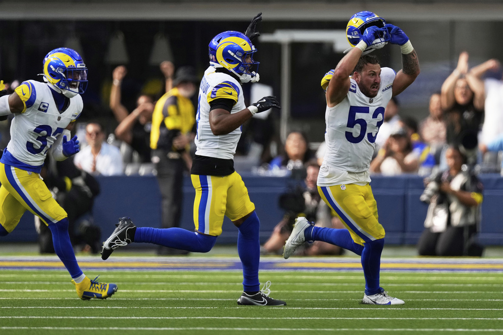 Los Angeles Rams linebacker Nate Landman (53) celebrates with safety Quentin Lake, left, and cornerback Ahkello Witherspoon after recovering a fumble by Houston Texans running back Dare Ogunbowale during the second half of an NFL football game, Sunday, Sept. 7, 2025, in Inglewood, Calif. (AP Photo/Mark J. Terrill)