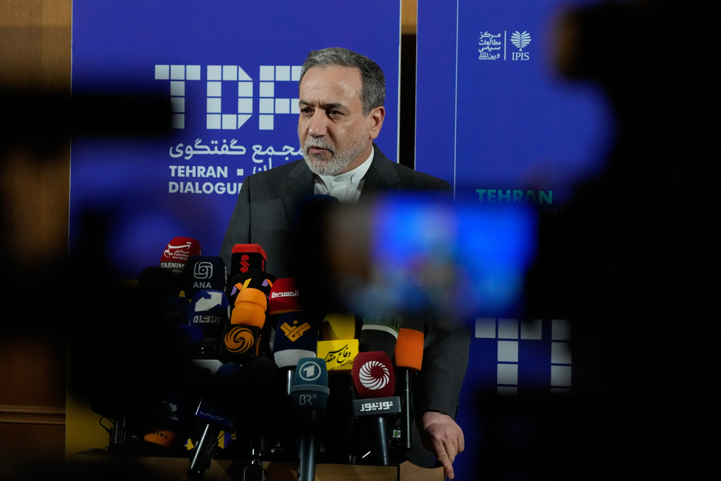 Iranian Foreign Minister Abbas Araghchi speaks in a new briefing after attending a conference titled "International Law Under Assault: Aggression and Self-Defense," in Tehran, Iran, Sunday, Nov. 16, 2025. (AP Photo/Vahid Salemi)