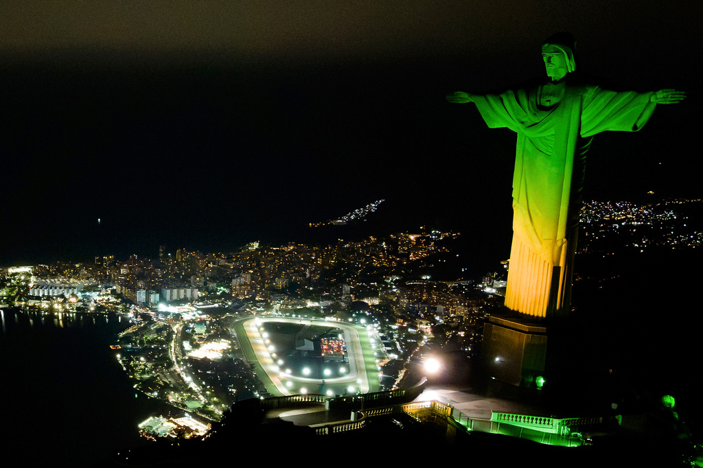 Christ the Redeemer monument is illuminated in Brazil's national colors as part of the countdown to the 2027 FIFA Women's World Cup, in Rio de Janeiro, Brazil, Tuesday, June 23, 2026. (AP Photo/Dhavid Normando)